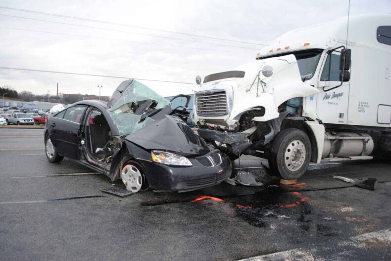 Fatal accident scene - motor vehicle crash involving a passenger car and commercial tractor-trailer truck