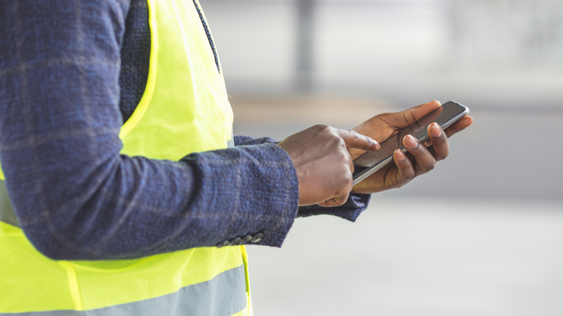 Foreman sends instructions to an injured employee via smartphone on beginning the claims process.