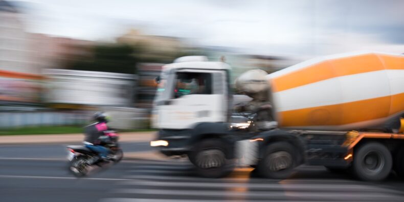 Motorcycle collision with a large concrete truck in Long Beach