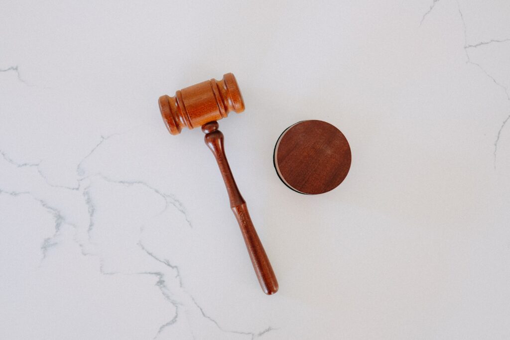 brown gavel on white marble 