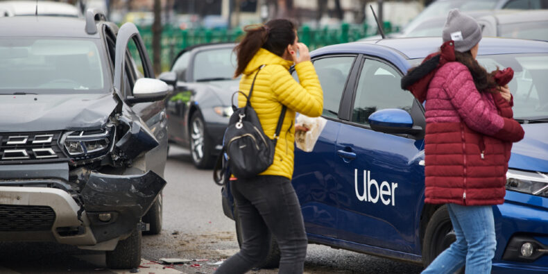 Rideshare accidents - Uber accident victims walking away from a car accident