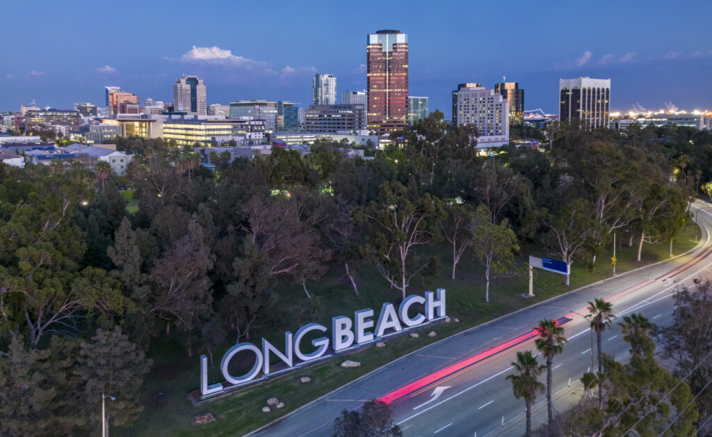 3d capital letters spell out Long Beach along side the 710 freeway leading to the downtown area.