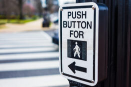 Push button to cross road crosswalk sign in USA