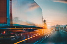 saturated angle of large commercial truck speeding on the highway in Long Beach